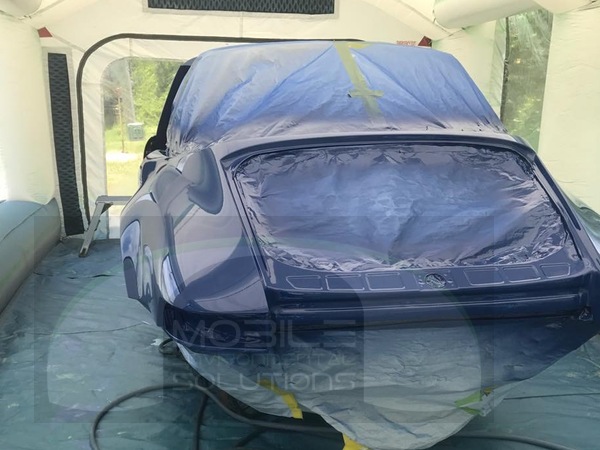 portable car paint booth with blue porsche