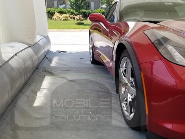portable car paint booth with red vette